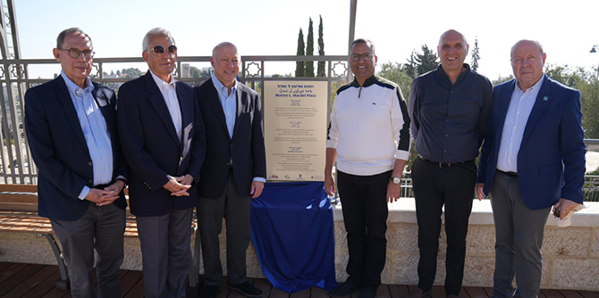 Dignitaries standing with the plaza plaque (Photo: Simanim)