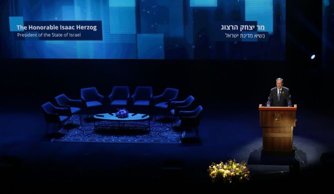 President Isaac Herzog speaking at a podium