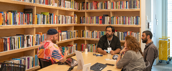 Mandel fellows in library (Photo: Simanim Productions)